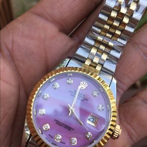 A pearl face Rolex presidential two tone